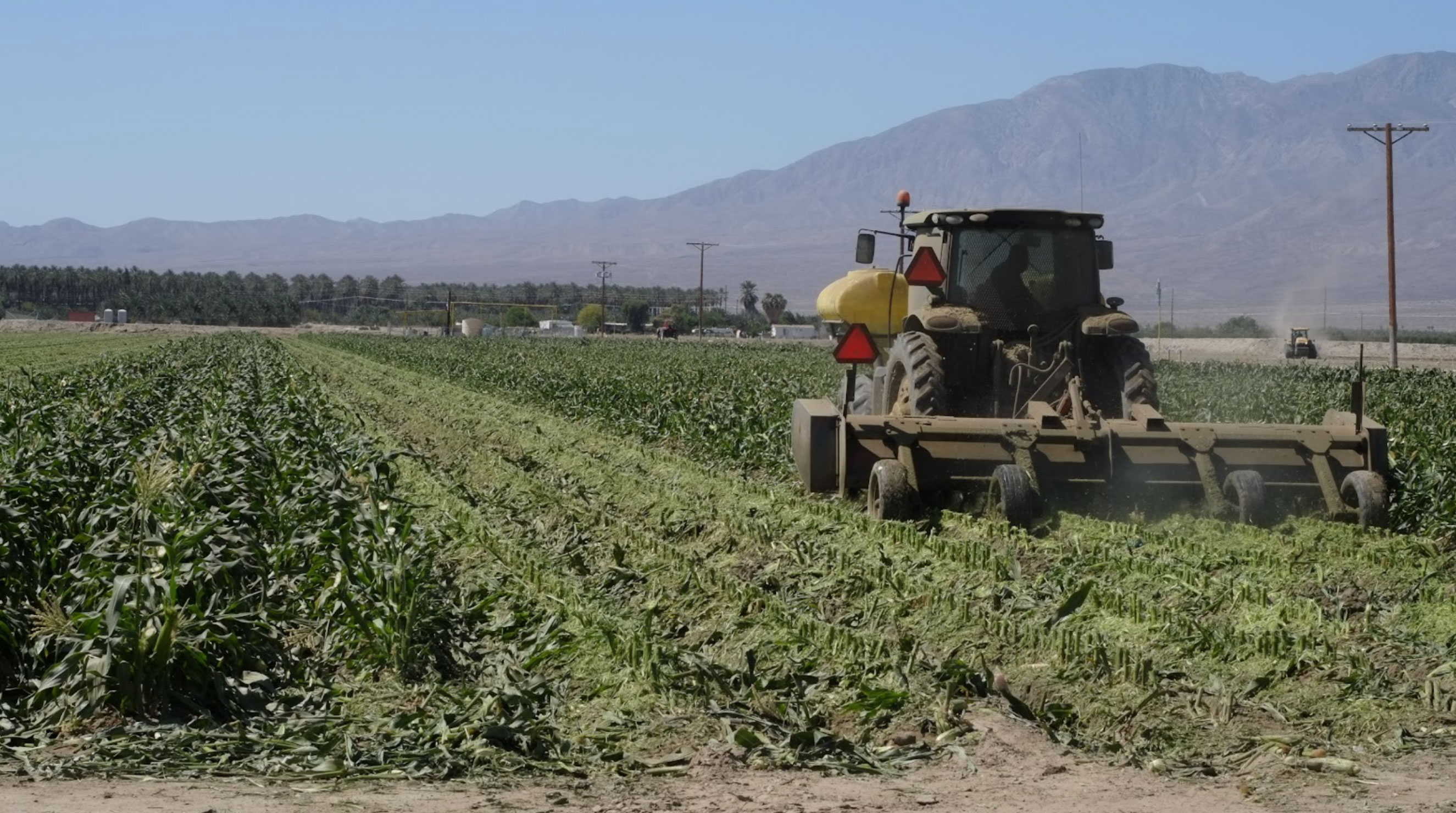 A tractor plowing a field